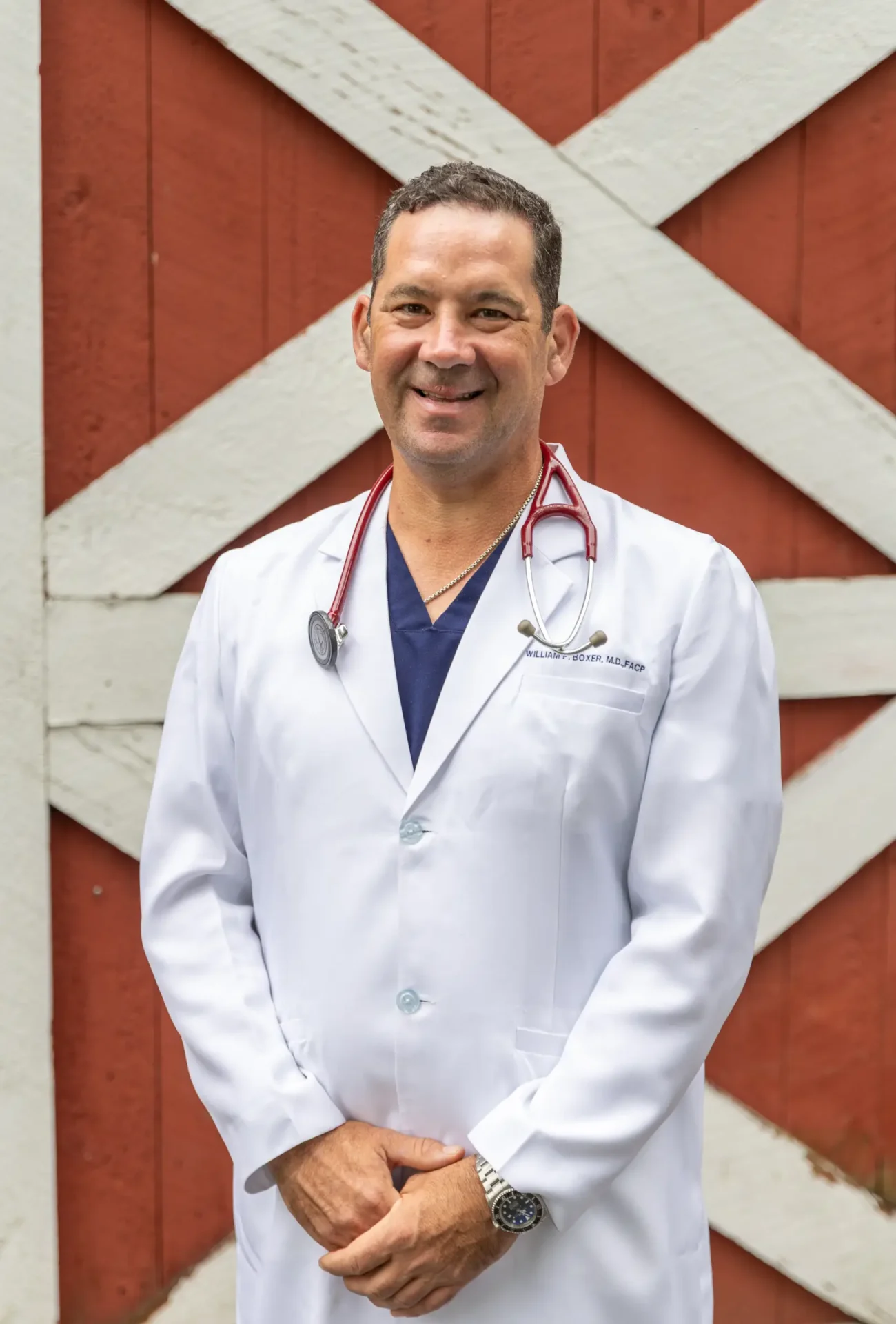 doctor and the barn behind him