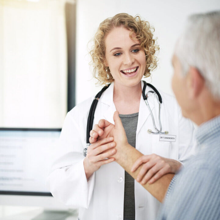 Doctor examining patient's arm