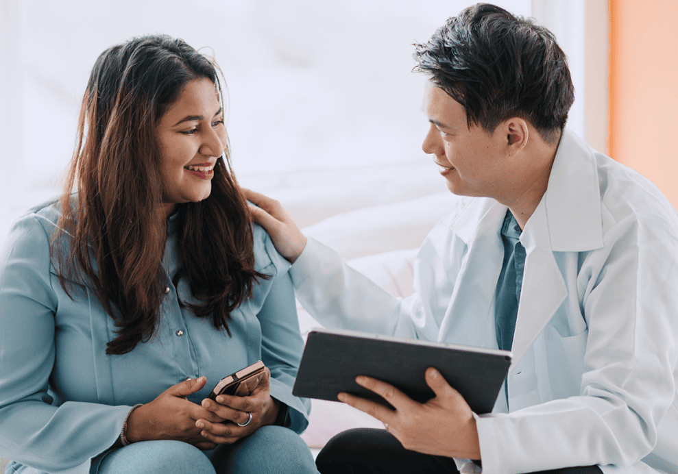Doctor comforting patient with a smile