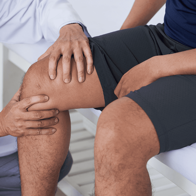 Physician assessing knee health